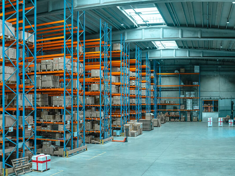 Rows of warehouse shelving stocked with boxed cargo